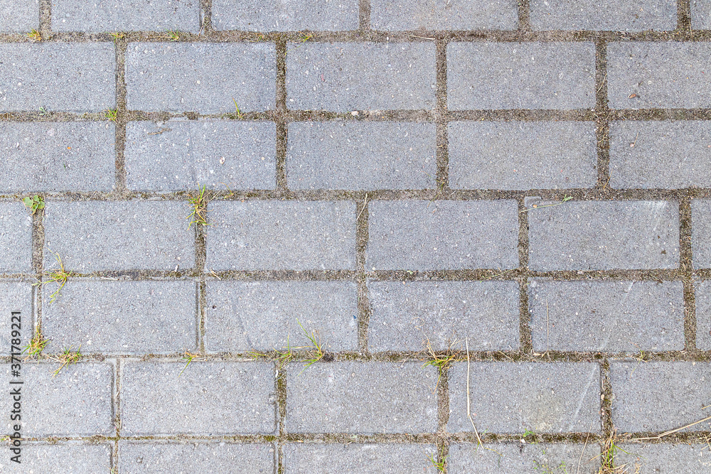 Abstract background - gray paving slabs in the form of squares. View from above. Abstract background - gray paving slabs in the form of squares. View from above.