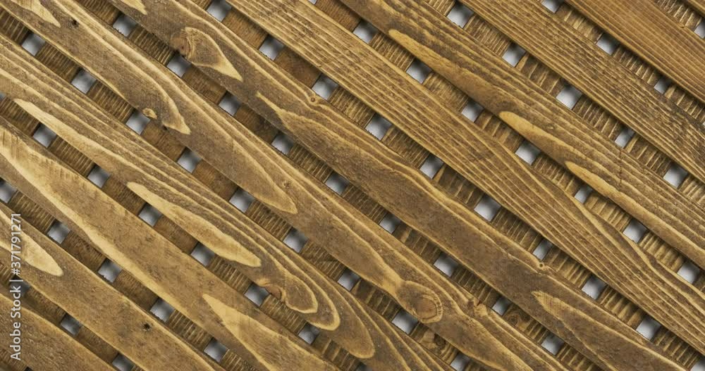 Rotation and zoom of a beautiful wooden lattice. Top view