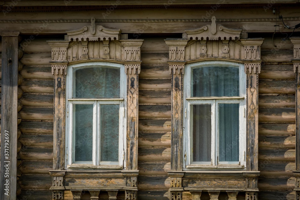 House with carved wooden windows House with carved wooden windows