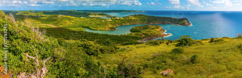 A panorama view from the Blockhouse viewpoint towards Indian Creek on the coast of Antigua photo