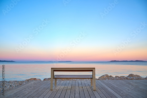 empty bench in hyeres at sunset france provence photo