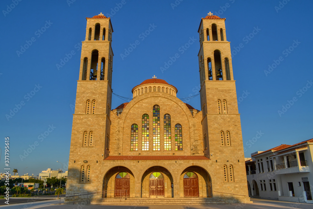 Agioi Anargyroi Orthodox Cathedral in Paphos, Cyprus. View of the church in the sun at sunset.