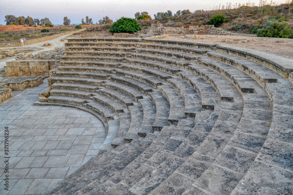 An ancient amphitheater located in an archaeological site in Paphos, Cyprus.  Beautifully preserved theater made of sandstone and marble.