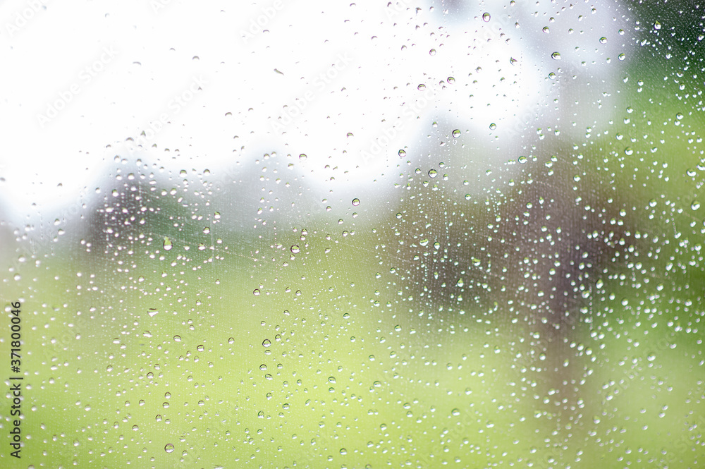 Rain drops on the car windows in the rain.
Rain drops on the car windows in the rain.