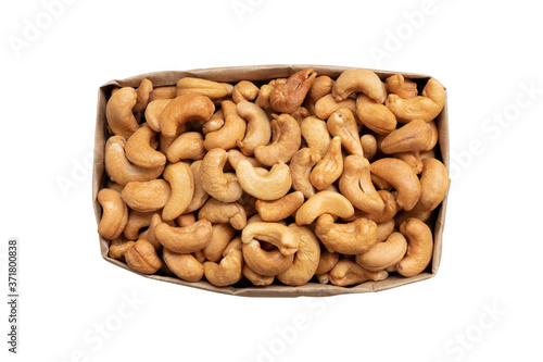 top view of roasted cashew nut in paper bag isolated on white background