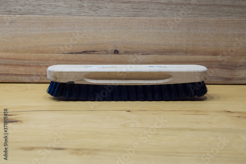brush for leather shoes with wooden background