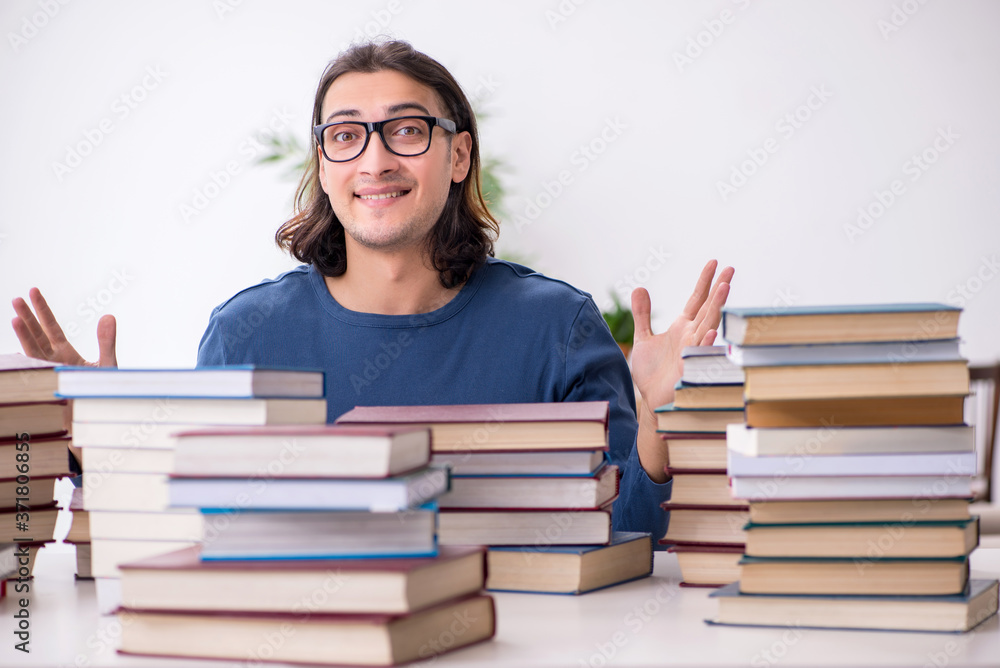 Young male student preparing for exams at home Young male student preparing for exams at home