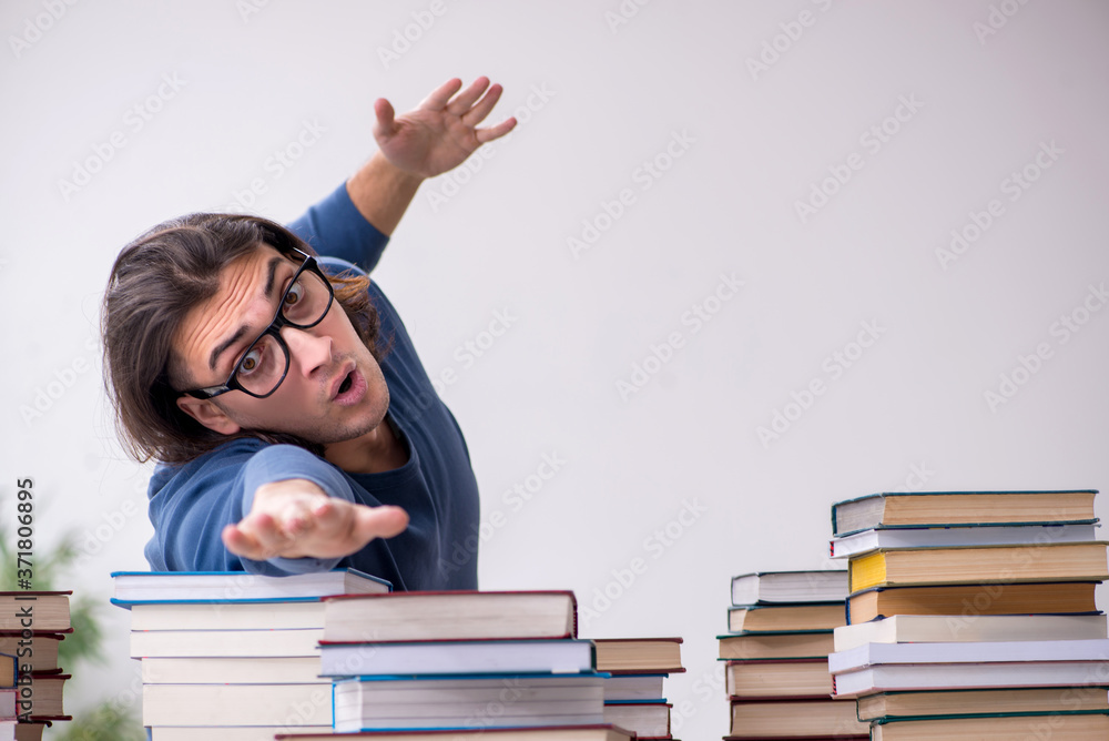 Young male student preparing for exams at home Young male student preparing for exams at home