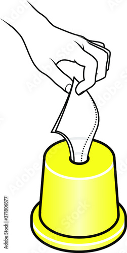 Hand pulling a tissue from a yellow table top tissue roll dispenser.