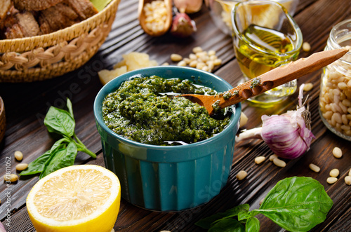 Food background of genovese pesto sauce and its ingredients representing mediterranean cuisine