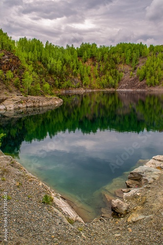small lake in the rocks in the forest
