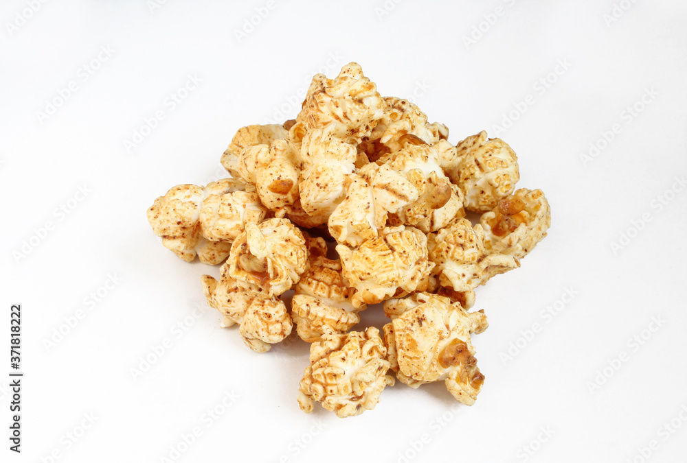 Brown popcorn with peanuts flavor isolated on white background Brown popcorn with peanuts flavor isolated on white background