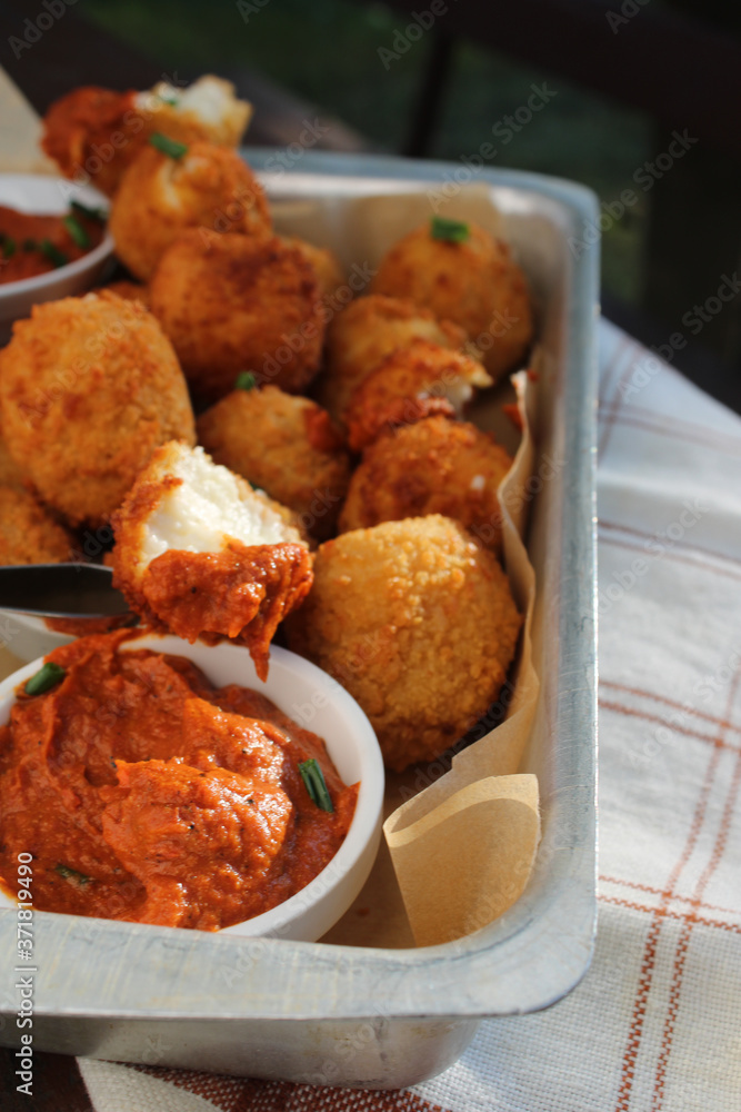 Cheese balls with tomato sauce. Fried snack starter meal. Party food Cheese balls with tomato sauce. Fried snack starter meal. Party food