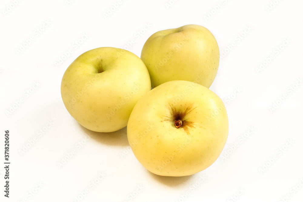 Three yellow apples isolated on white background. Above and closeup Three yellow apples isolated on white background. Above and closeup