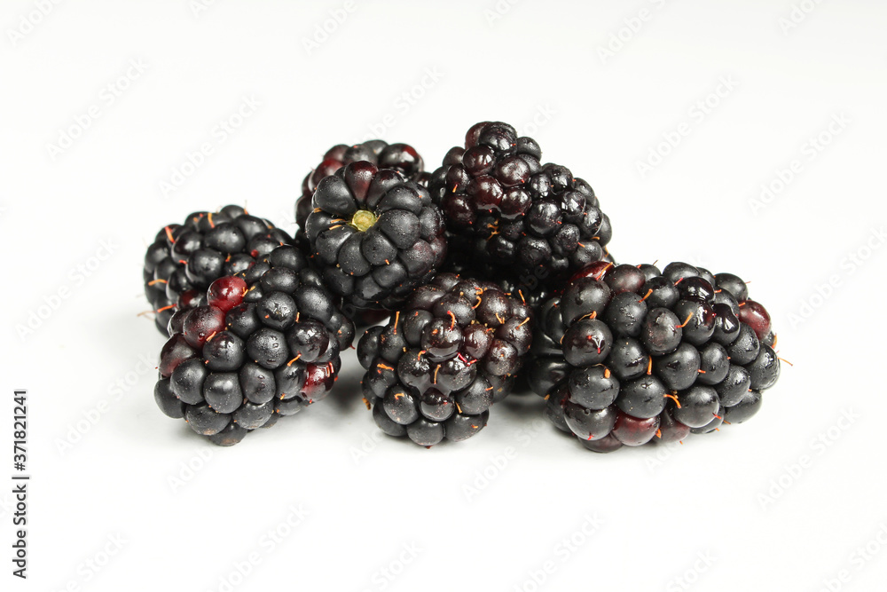 Pile of wet blackberries isolated on white background. Fresh fruit Pile of wet blackberries isolated on white background. Fresh fruit