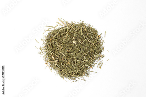 Pile of dried green herb isolated on white background. Dry food spice