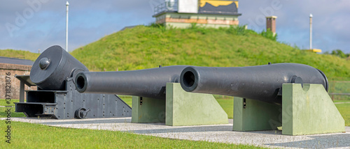 A 13-inch mortar and two 10-inch Rodman cannon, examples of the guns of Fort Moultrie, located on Sullivan's Island, SC, USA. photo