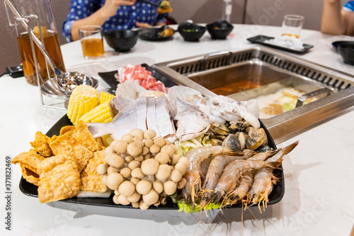 Steamboat hotpot meal with luxurious seafood sliced meat ingredients