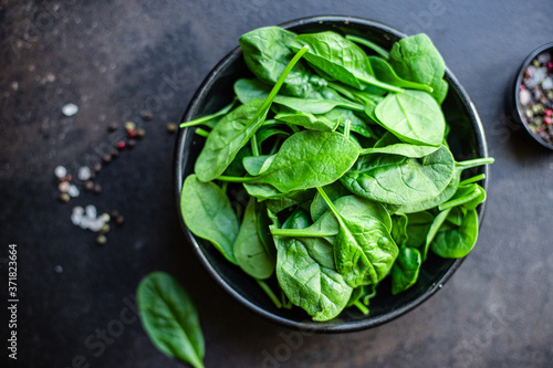 spinach green juicy leaves organic salad serving portion size natural product top view place for text copy space keto or paleo diet raw