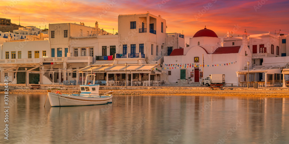 Panoramic view at sunset of old harbour in Mykonos town, Greece, Europe.  Golden hours. Travel and holiday concept. - obrazy, fototapety, plakaty 
