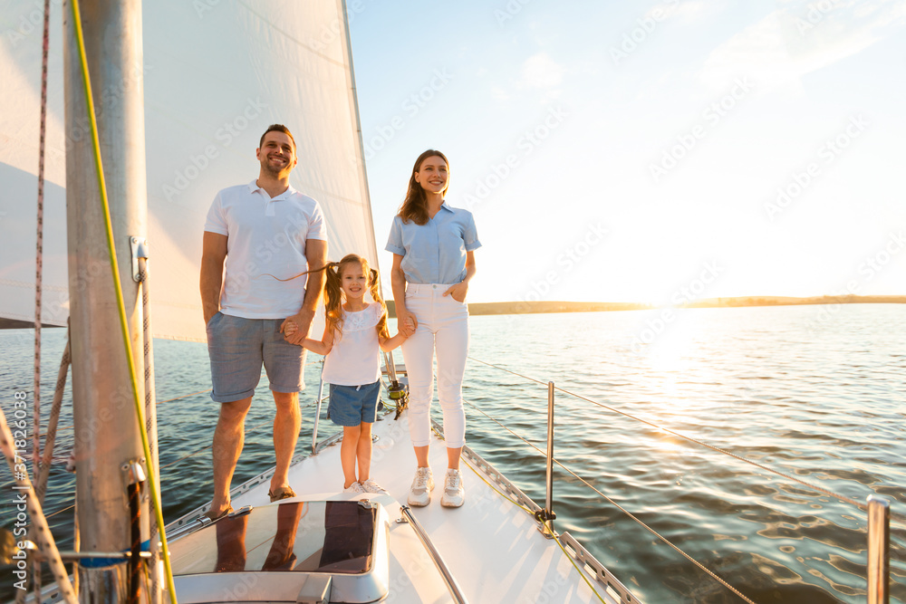 Parents And Kid Girl Standing On Yacht Deck Holding Hands Parents And Kid Girl Standing On Yacht Deck Holding Hands