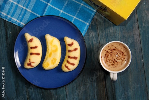 Canvas Print Banana soft cake or popular as Tokyo banana cake are being served with tea / cof