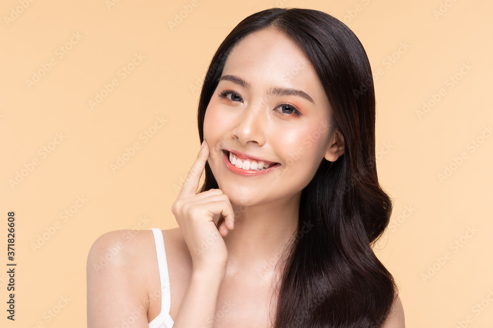 Beautiful Asian woman looking at camera smile with clean skin Beautiful Asian woman looking at camera smile with clean skin