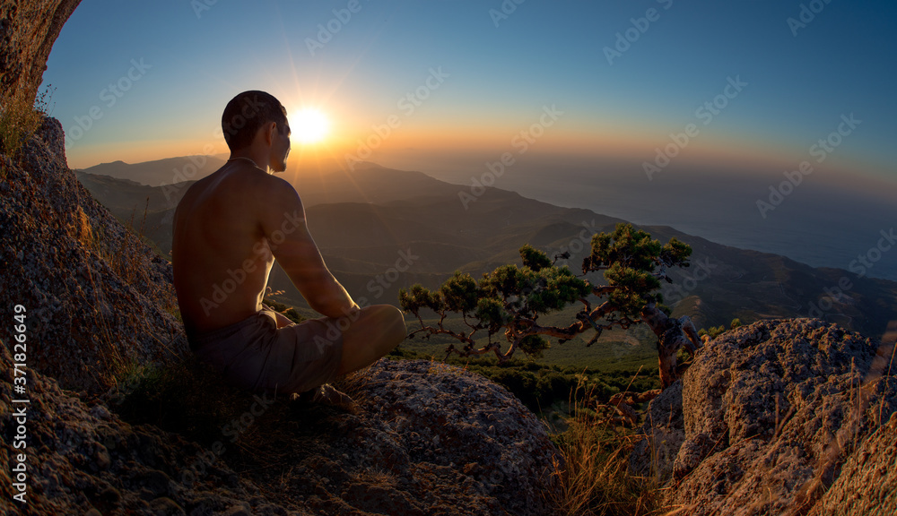 traveler meditate on mountain