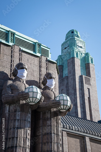 Helsinki Central Railway Station's Statues Using Face Masks During Coronavirus Time photo