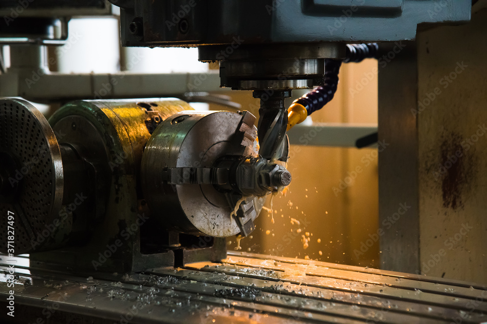 Fototapeta premium Cutting tool at metal working on lather machine