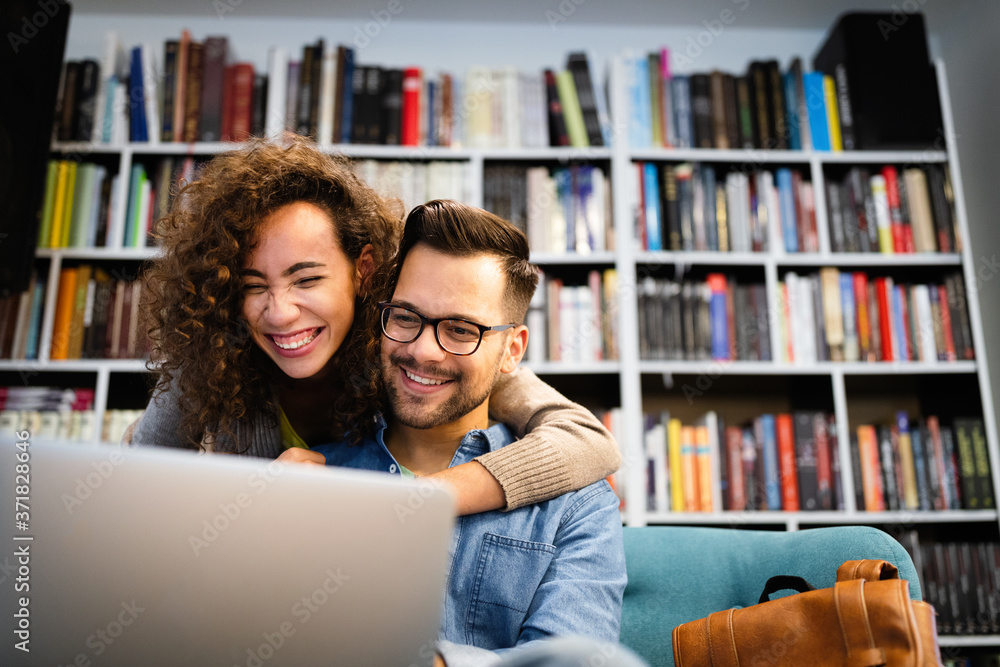 Students are studying together in library. Couple, study, technology, education love concept Students are studying together in library. Couple, study, technology, education love concept