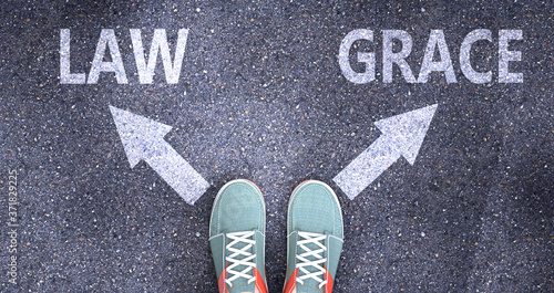Fotografie Law and grace as different choices in life - pictured as words Law, grace on a r