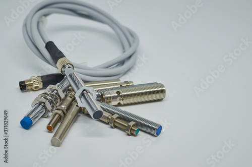 Many Inductive proximity sensor or proximity switch on a white background.