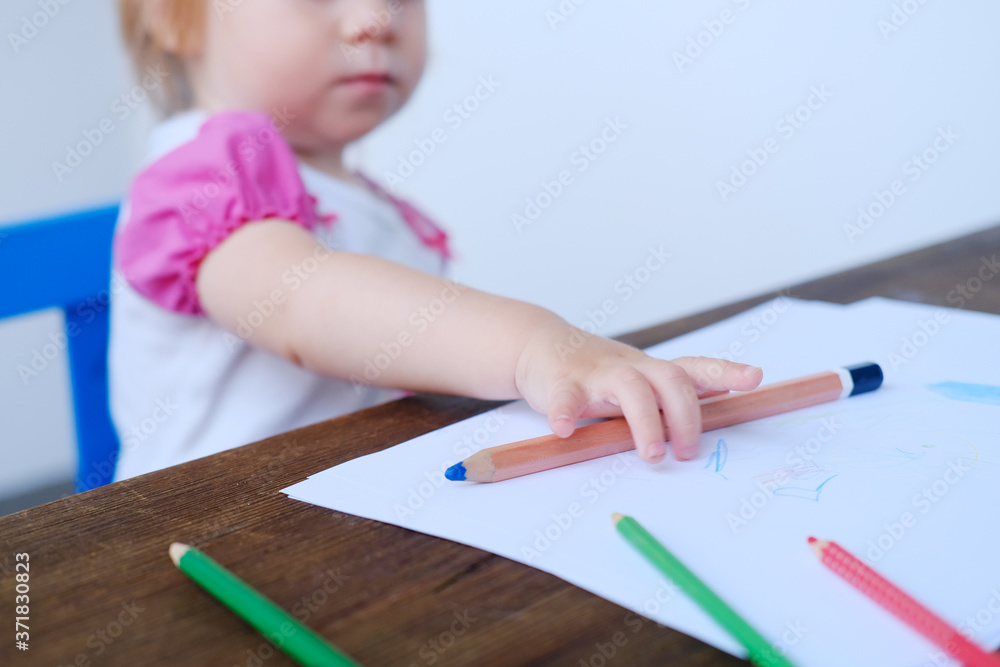 kid, baby draws doodles with colored pencils, concept of creativity, happy childhood, children's games, alpha generation kid, baby draws doodles with colored pencils, concept of creativity, happy childhood, children's games, alpha generation