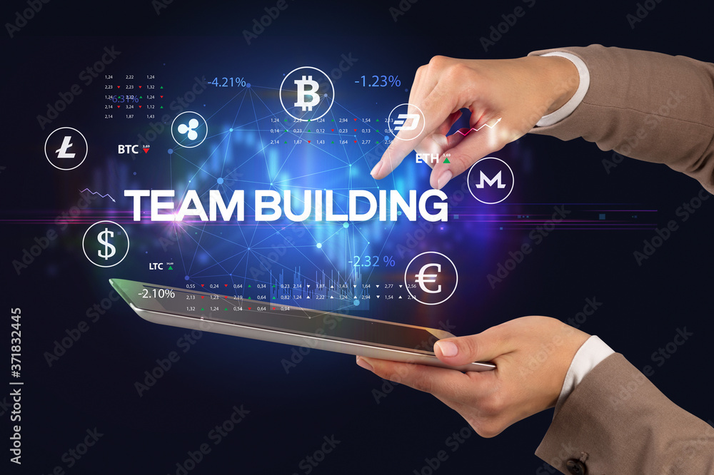 Close-up of a touchscreen with TEAM BUILDING inscription, business opportunity concept Close-up of a touchscreen with TEAM BUILDING inscription, business opportunity concept