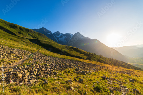 Fototapeta Naklejka Na Ścianę i Meble -  Mountain landscape of the french Alps, Massif des Ecrins. Scenic alpine landscape at high altitude with glacier, green meadows and hiking paths for tourism summer vacation
