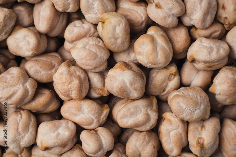 Top view. Dried chickpea beans close up background. Macro shoot. Top view. Dried chickpea beans close up background. Macro shoot.