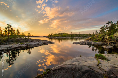 Lake in Karelia. Russia. Lake Ladoga at dawn. Nature regions of Russia. Skers of Lake Ladoga. Tourism Russia. Landscapes of Northern Nature. Rocky coast of Ladoga. Guide to Karelia. Russian north