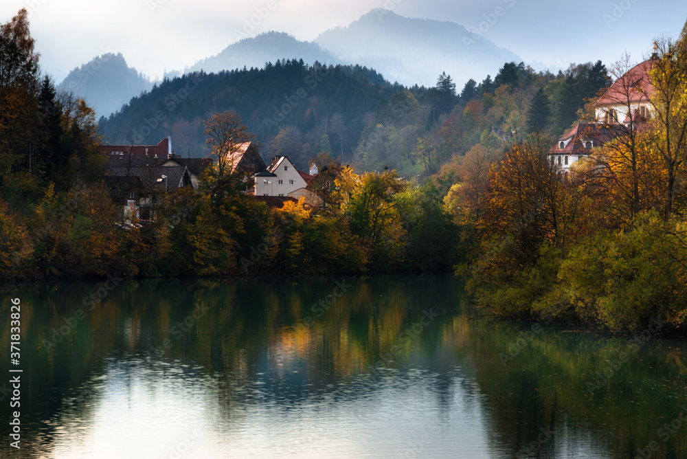 Amazing autumn landscape at sunset. View on Fussen town and Lech river. Bavaria. Southern Germany.