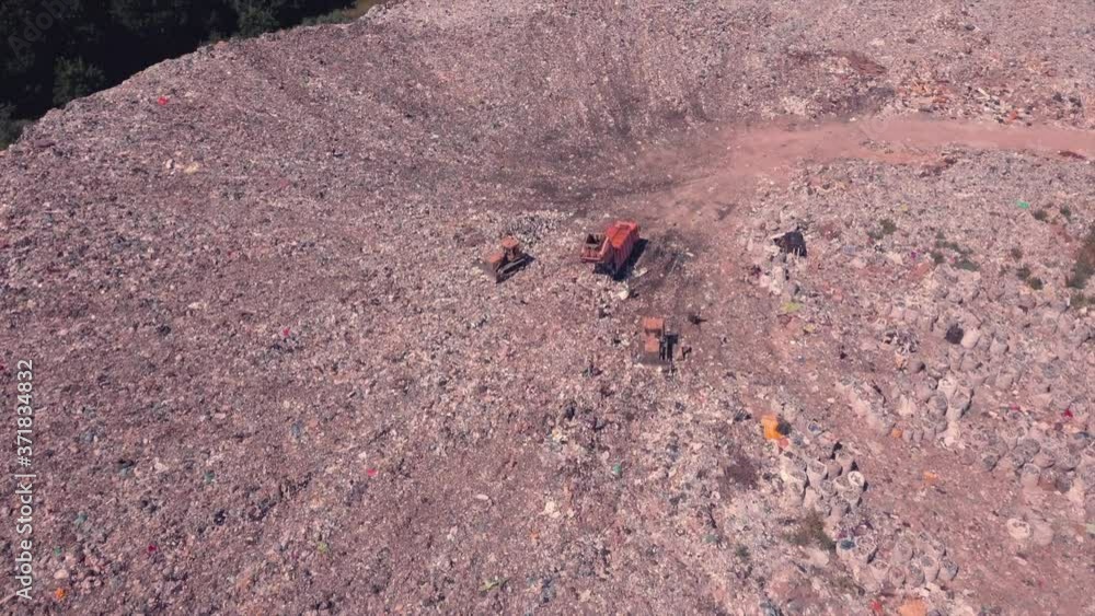 Technician flying over landfill equals mountains of household waste, Ukraine. Environmental problem, technology disruption, disaster Technician flying over landfill equals mountains of household waste, Ukraine. Environmental problem, technology disruption, disaster