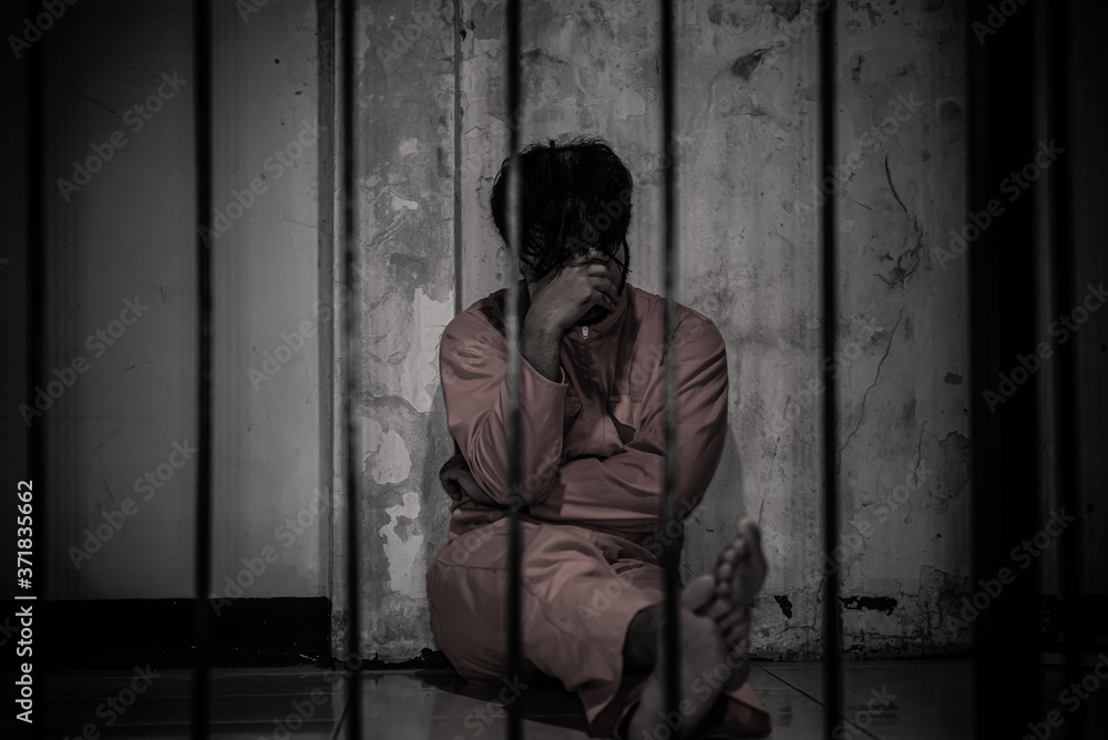 Asian man desperate at the iron prison,prisoner concept,thailand people,Hope to be free,Serious prisoners imprisoned in the prison