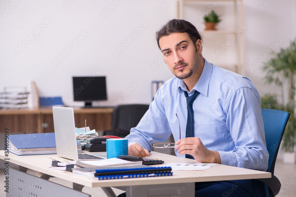 Fototapeta premium Sick male employee suffering at workplace