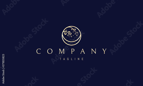 Vector golden logo in which an abstract image of a rose bush bending over the moon.