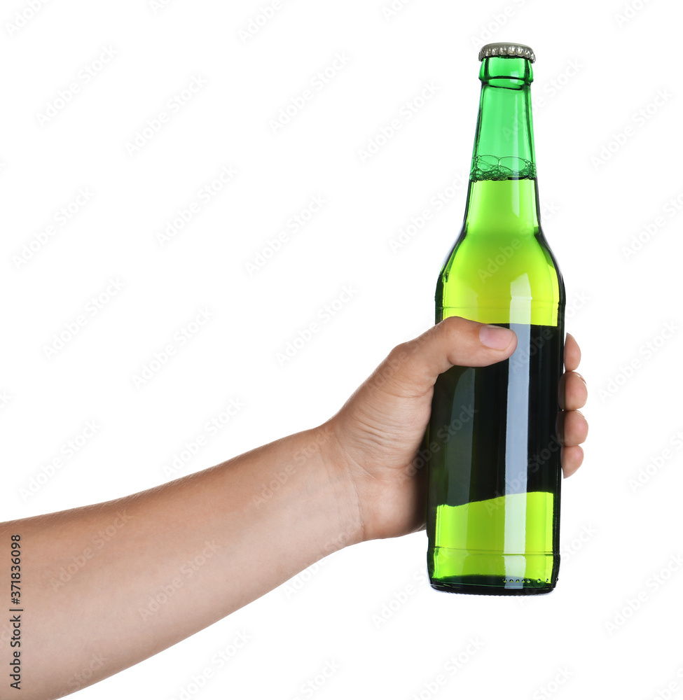 Man holding green bottle with beer on white background, closeup Man holding green bottle with beer on white background, closeup