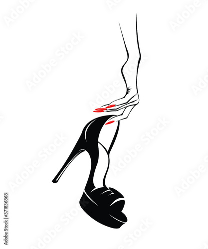 Woman hand with beautiful red nail polish manicure and stiletto shoe.High heels fashion item.Accessories, style and beauty illustration.Elegant, luxury nails art and footwear.