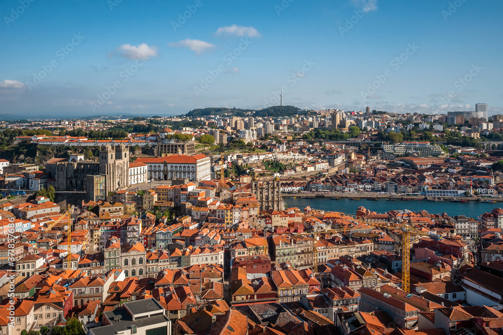 Porto, Portugal, panoramic view of cityscape overlooking the Historic Centre and Douro River by day during summer.