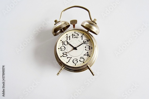 Alarm clock on a light background close-up. The concept of getting up in the morning and being late