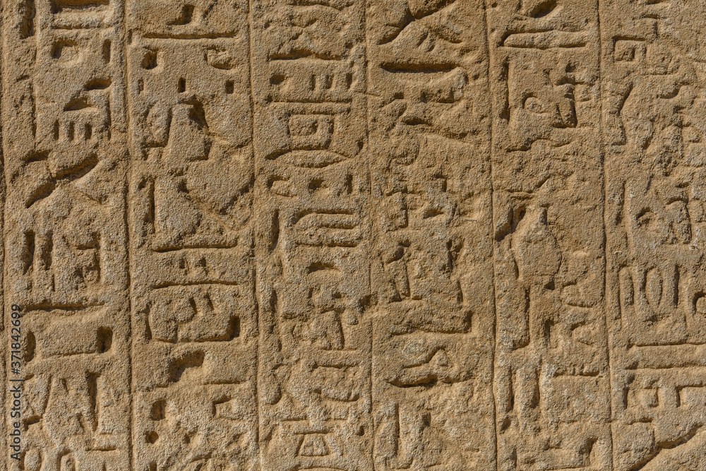 Egyptian ancient hieroglyphs on the stone wall