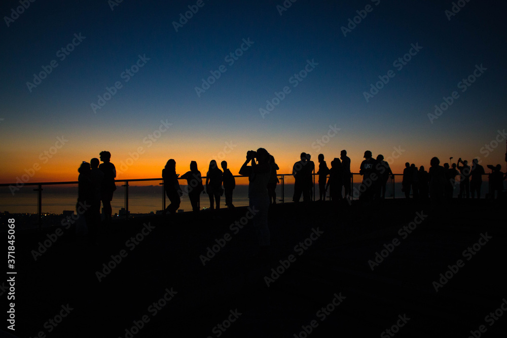 silhouette of people at sunset silhouette of people at sunset