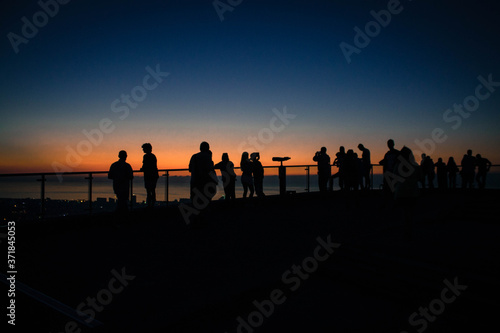 silhouette of people at sunset